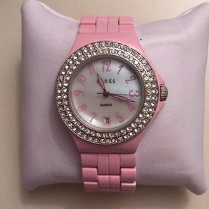 Pink metal summer watch with a faux diamond bezel